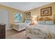 Two twin beds and nautical themed bedding in a guest bedroom at 1007 Baseball And Boardwalk Ct, Kissimmee, FL 34746