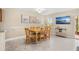 Bright dining room with tile floors, neutral paint, and a sliding glass door to a covered patio at 1007 Baseball And Boardwalk Ct, Kissimmee, FL 34746