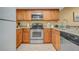 Well-equipped kitchen featuring granite countertops and stainless steel appliances at 1007 Baseball And Boardwalk Ct, Kissimmee, FL 34746