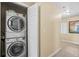 Convenient in-unit stacked washer and dryer in hallway at 1007 Baseball And Boardwalk Ct, Kissimmee, FL 34746