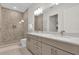 Double vanity bathroom with a walk in shower at 1038 Jack Nicklaus Ct, Kissimmee, FL 34747