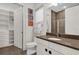 Modern bathroom with a walk-in shower, toilet and vanity with a brown countertop at 1038 Jack Nicklaus Ct, Kissimmee, FL 34747