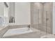 Bathroom with soaking tub and glass shower at 1038 Jack Nicklaus Ct, Kissimmee, FL 34747