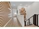 Upper hallway with wood wall and modern art at 1038 Jack Nicklaus Ct, Kissimmee, FL 34747