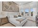 Bright main bedroom with large window, featuring a king-size bed and wooden nightstands at 1038 Jack Nicklaus Ct, Kissimmee, FL 34747