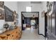 Bright and spacious entryway with rustic wooden furniture and gallery wall at 1101 Atlantic Ave, Fruitland Park, FL 34731