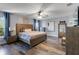 Main bedroom with wood-look flooring and ceiling fan at 1101 Atlantic Ave, Fruitland Park, FL 34731