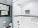 Modern bathroom with white subway tiles, built-in shelves, and bathtub at 1105 Superior Ct, Winter Springs, FL 32708