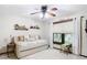 Cozy bedroom with a daybed, built-in shelves, and a large window at 1105 Superior Ct, Winter Springs, FL 32708