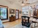 Home office with wood desk, French doors, and view into kitchen area at 1105 Superior Ct, Winter Springs, FL 32708