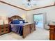 Spacious main bedroom with pool view and wooden furniture at 1105 Superior Ct, Winter Springs, FL 32708