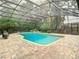 Enclosed pool area with brick pavers and a tranquil water feature at 1105 Superior Ct, Winter Springs, FL 32708