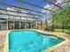 Sparkling screened pool with paver deck at 1105 Superior Ct, Winter Springs, FL 32708