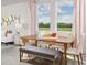 Dining area with wooden table, bench seating, and large windows at 1341 Current Pl, Haines City, FL 33844