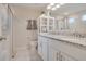 Double vanity bathroom with granite countertop and shower at 13805 Bressler Aly, Windermere, FL 34786