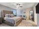 Main bedroom with plush bed, large mirror, and ceiling fan at 13805 Bressler Aly, Windermere, FL 34786