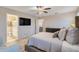 Bedroom with ensuite bathroom and large TV at 13805 Bressler Aly, Windermere, FL 34786