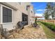 Relaxing patio with seating area, grill, and screened enclosure at 13805 Bressler Aly, Windermere, FL 34786