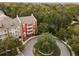 Aerial view of apartment building near a roundabout and trees at 1410 Celebration Ave # 101, Celebration, FL 34747