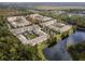 Aerial view of apartment buildings and a pond at 1410 Celebration Ave # 101, Celebration, FL 34747