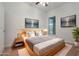 Virtually staged bedroom with a queen-size bed and wood frame at 1410 Celebration Ave # 101, Celebration, FL 34747