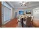 Virtually staged dining room with hardwood floors at 1410 Celebration Ave # 101, Celebration, FL 34747