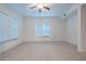 Bright living room with tile floors and neutral walls at 1410 Celebration Ave # 101, Celebration, FL 34747