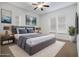 Virtually staged main bedroom with plush bedding at 1410 Celebration Ave # 101, Celebration, FL 34747