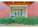 Private patio with double doors and landscaping at 1410 Celebration Ave # 101, Celebration, FL 34747