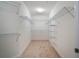 Large walk-in closet with ample shelving at 1410 Celebration Ave # 101, Celebration, FL 34747