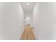 Clean hallway with light walls and hardwood floors at 14255 Spring Garden Dr, Winter Garden, FL 34787