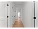 Clean and bright hallway with light wood floors at 14255 Spring Garden Dr, Winter Garden, FL 34787