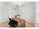 Modern home office with wood floors and a large window at 14255 Spring Garden Dr, Winter Garden, FL 34787