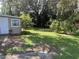 Large backyard with mature trees and lush grass at 1604 Old Apopka Rd, Apopka, FL 32703