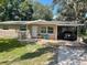 Ranch style home with carport and mature landscaping at 1604 Old Apopka Rd, Apopka, FL 32703