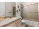 Clean bathroom with granite countertop and shower at 16669 Varone Cove Ct, Winter Garden, FL 34787