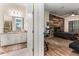 Bathroom with granite countertop, white cabinets and view into bedroom at 16669 Varone Cove Ct, Winter Garden, FL 34787