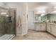 Large bathroom with double sinks and a walk-in shower at 16669 Varone Cove Ct, Winter Garden, FL 34787