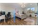 Charming bedroom with a bed, desk, and hardwood floors at 16669 Varone Cove Ct, Winter Garden, FL 34787