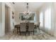 Formal dining room boasts a chandelier and large oval table at 16669 Varone Cove Ct, Winter Garden, FL 34787