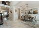 Elegant dining room with a large table, chandelier, and rug at 16669 Varone Cove Ct, Winter Garden, FL 34787