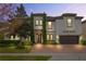 Two-story house with a white exterior, brown garage door, and a brick driveway at 16669 Varone Cove Ct, Winter Garden, FL 34787