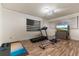 Home gym with treadmill, rowing machine, and weights at 16669 Varone Cove Ct, Winter Garden, FL 34787