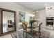 Kitchen nook with glass table and chairs, overlooking the backyard at 16669 Varone Cove Ct, Winter Garden, FL 34787