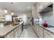 Modern kitchen featuring granite countertops and white cabinetry at 16669 Varone Cove Ct, Winter Garden, FL 34787