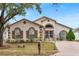 Exterior view of a charming one-story house with a well-maintained lawn at 2041 Black Hawk St, Clermont, FL 34714