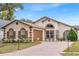 One story home with attached garage and landscaped front yard at 2041 Black Hawk St, Clermont, FL 34714