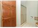 Bathroom with shower and plenty of cabinet storage at 214 Covent Garden Ave, Davenport, FL 33897