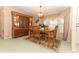 Dining room with wooden table, chairs, and built-in hutch at 214 Covent Garden Ave, Davenport, FL 33897