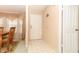 Home entryway with tiled floor, adjacent dining room, and interior door at 214 Covent Garden Ave, Davenport, FL 33897